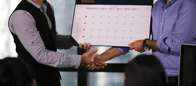 Business handshake with legal documents